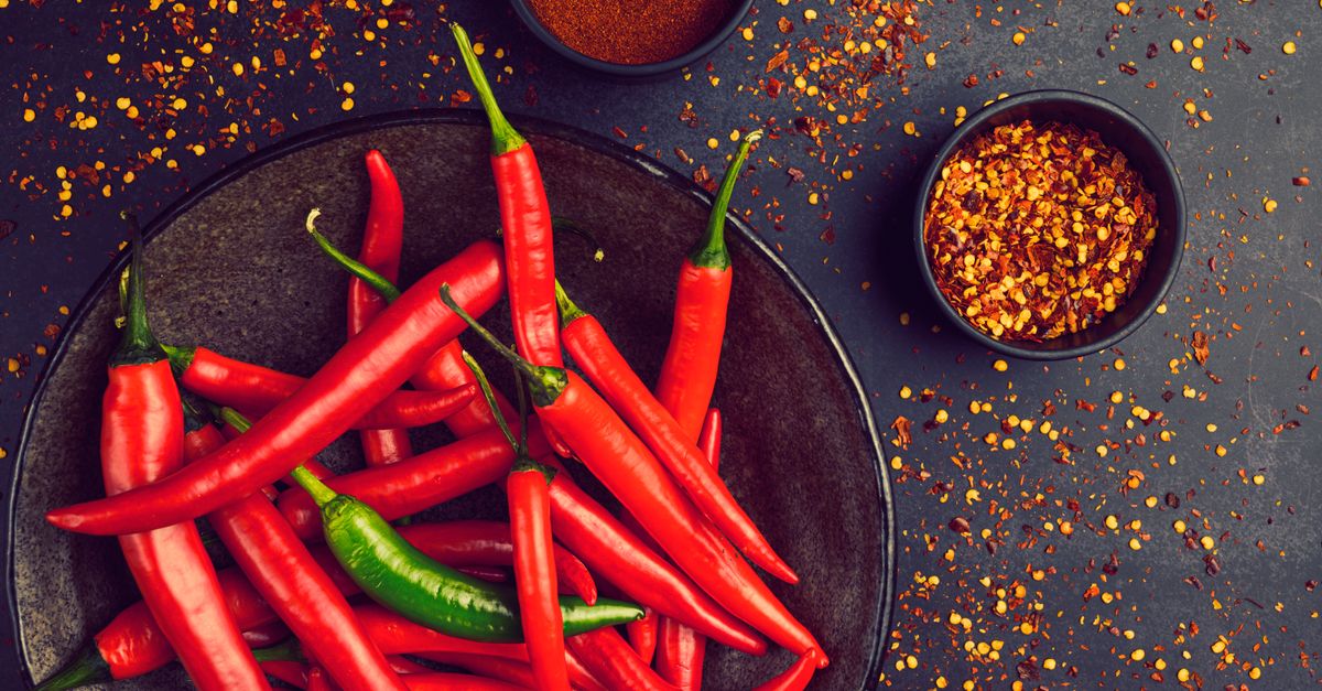Fresh red and green chillies in a bowl — the cause of chilli burn on hands