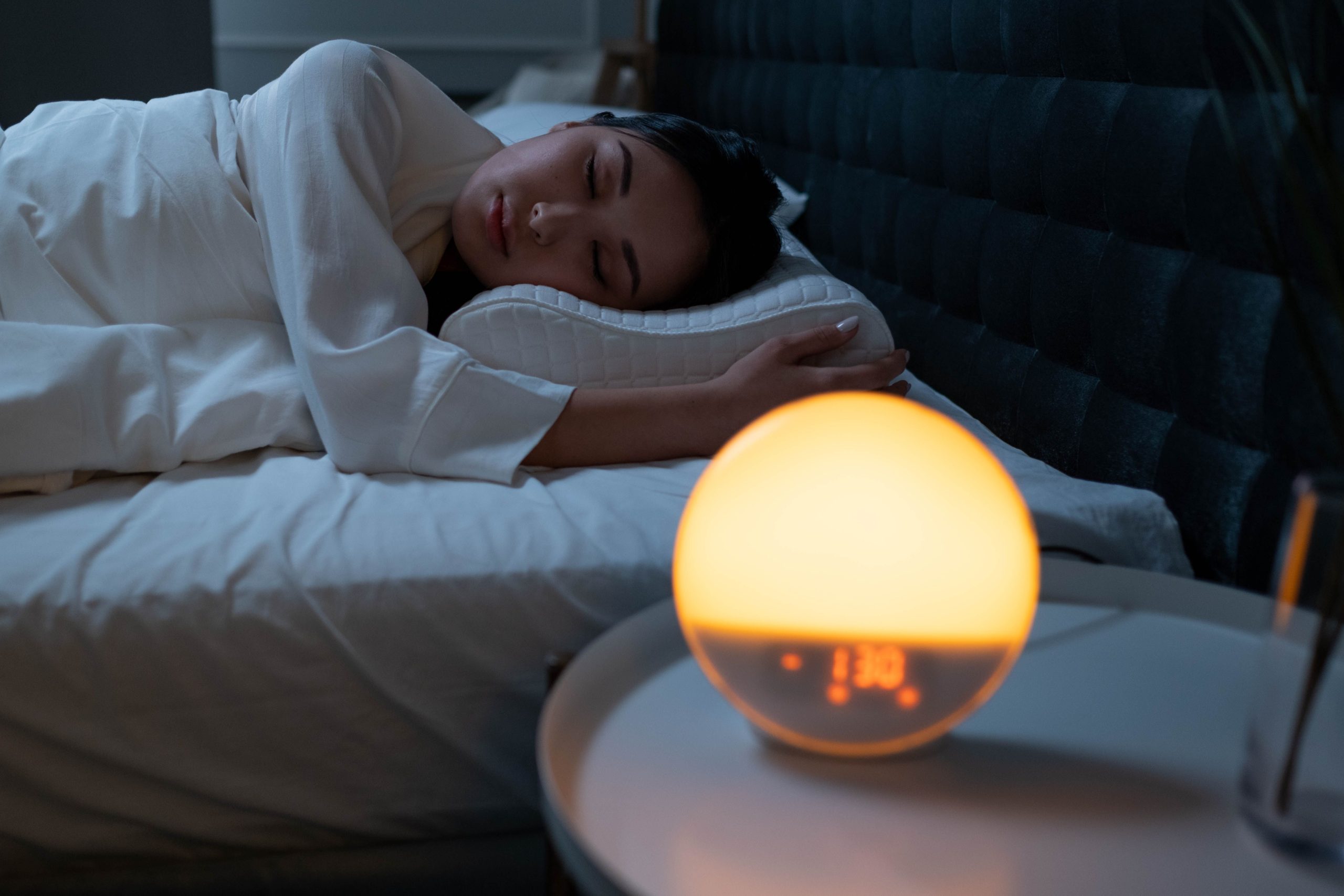 Woman sleeping peacefully in bed at night