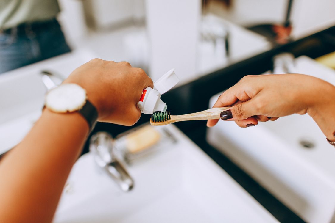 Toothpaste being applied to a soft toothbrush