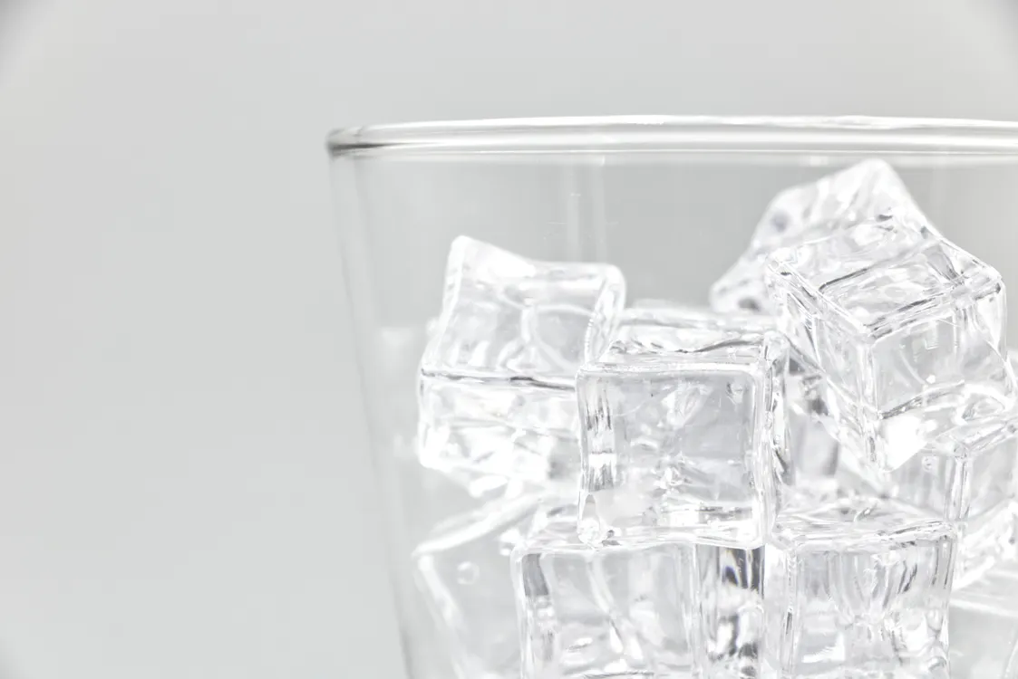 Ice cubes in a glass for icing a bitten tongue or cheek