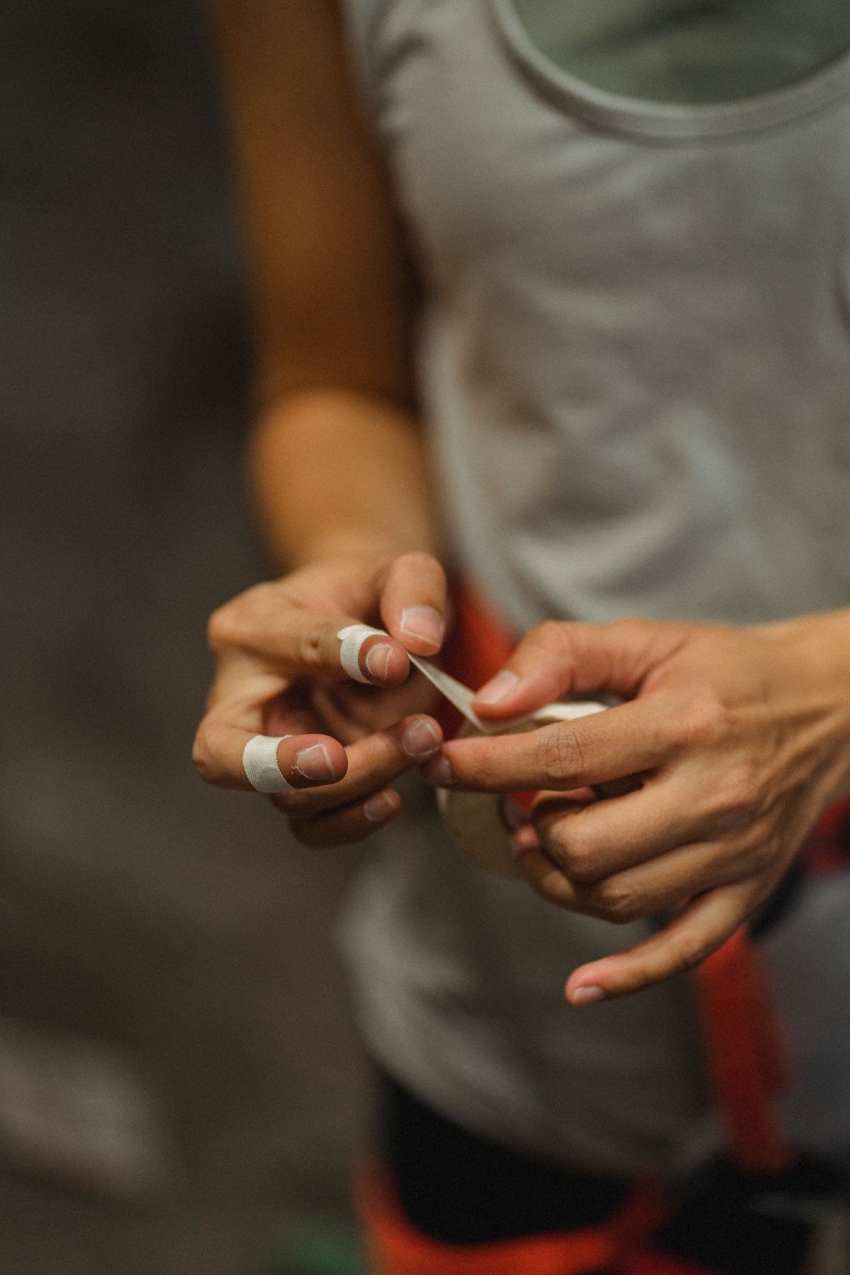 Taping an injured finger to its neighbour — buddy taping gives the jammed finger a natural splint