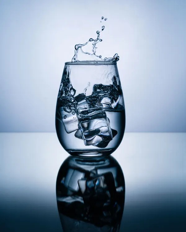Glass of cold water to cool a burned tongue