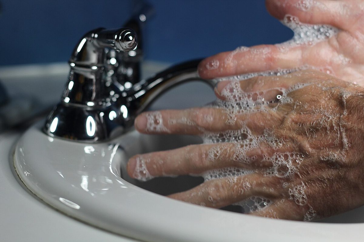 Washing the sting area with soap under running water