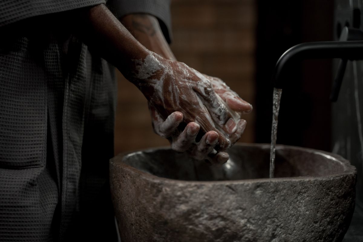 Washing hands with soap before touching the eye