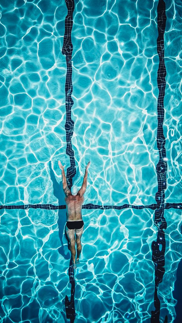 Swimmer seen from above in a pool lane